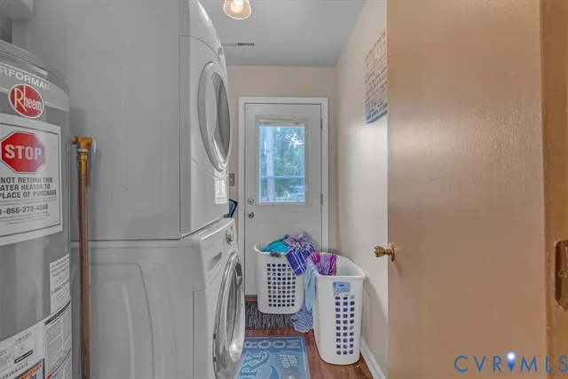 a view of an entryway with wooden floor