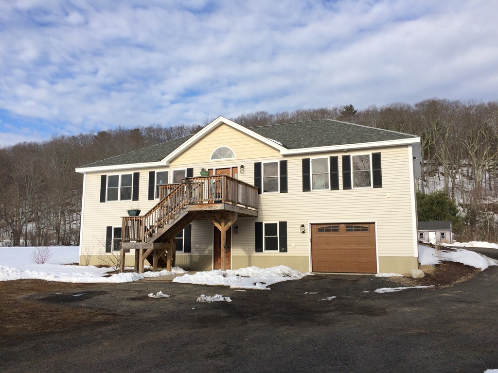 43 Brookfield Road Brimfield, MA 01010 - Photo 1 of 16 a front view of a house with a yard