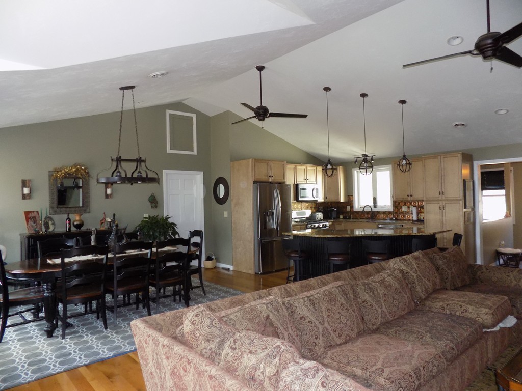 43 Brookfield Road Brimfield, MA 01010 - Photo 5 of 16 a living room with furniture kitchen view and a chandelier