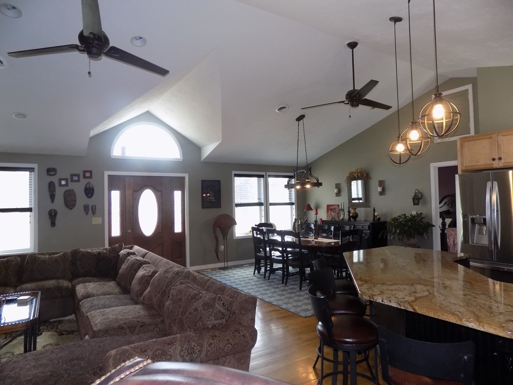 43 Brookfield Road Brimfield, MA 01010 - Photo 6 of 16 a living room with lots of furniture and a chandelier