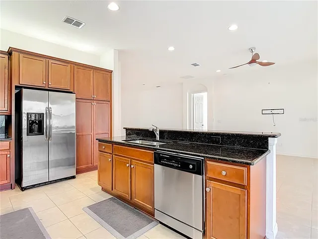a bathroom with a sink a toilet and shower curtain