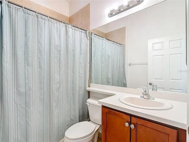 a bath tub sitting next to a bathroom sink