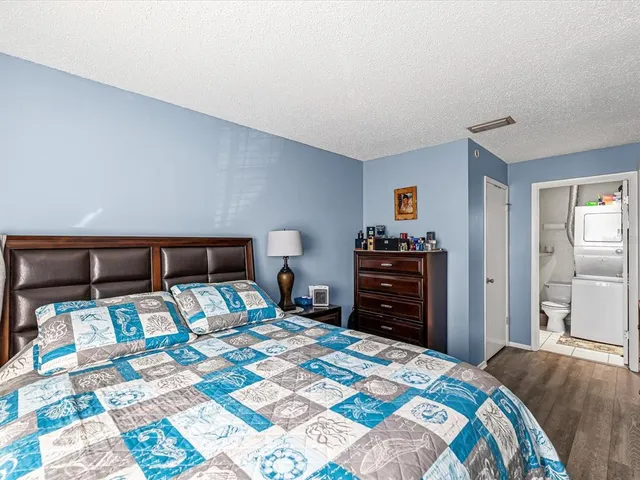 a bedroom with a bed and a dresser