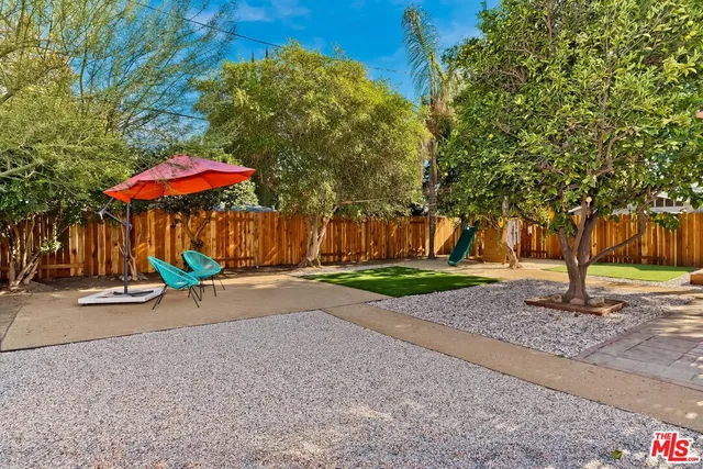 a view of a street with a park