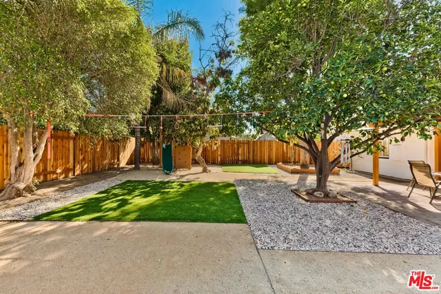 a view of a tree in front of a house