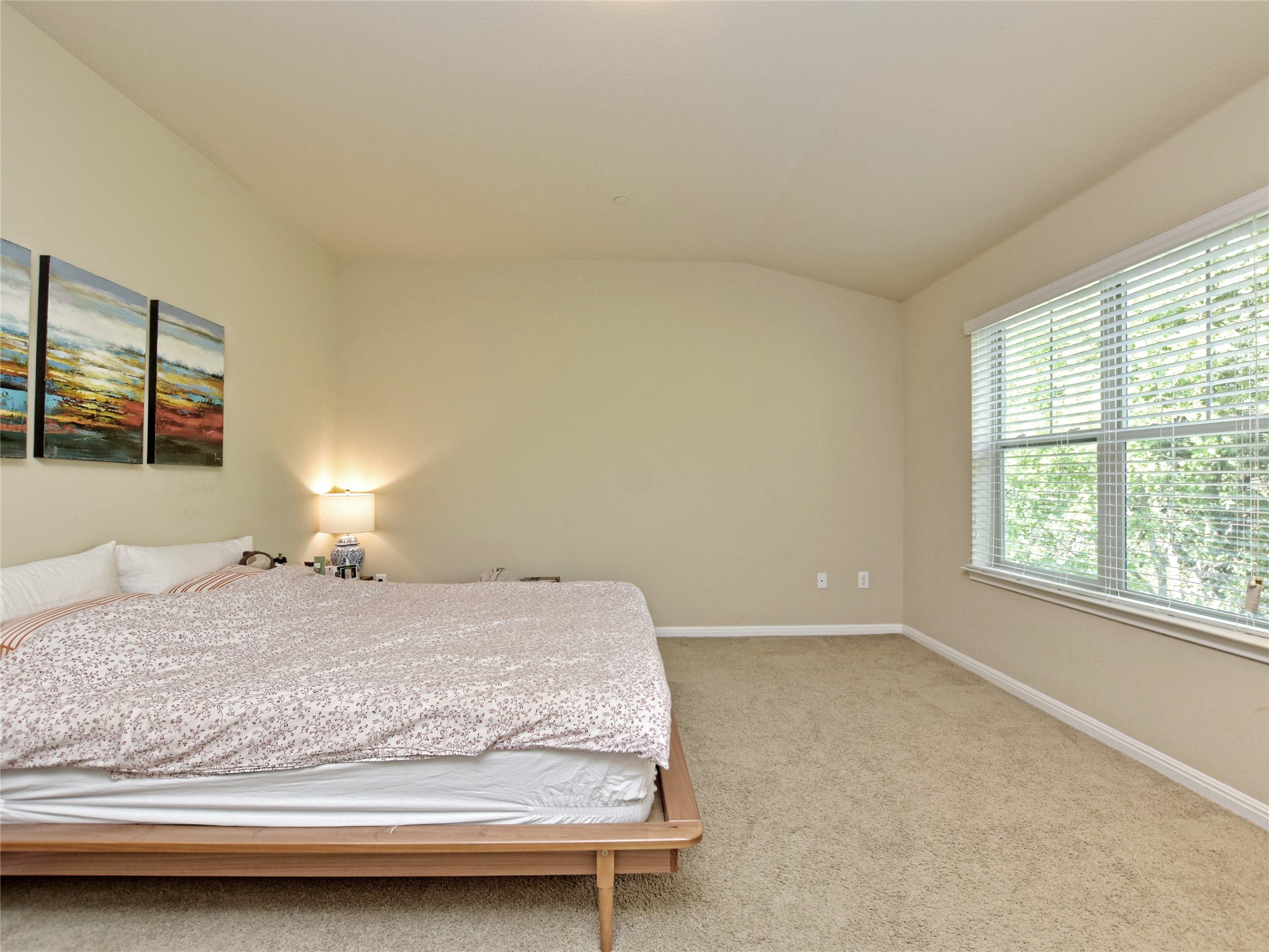 516 East Slaughter Lane, Unit 1801 Austin, TX 78744 - Photo 20 of 39 a bedroom with a bed and a window