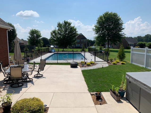 110 Hunters Point Tullahoma, TN 37388 - Photo 4 of 4 a view of a swimming pool with a patio and a garden