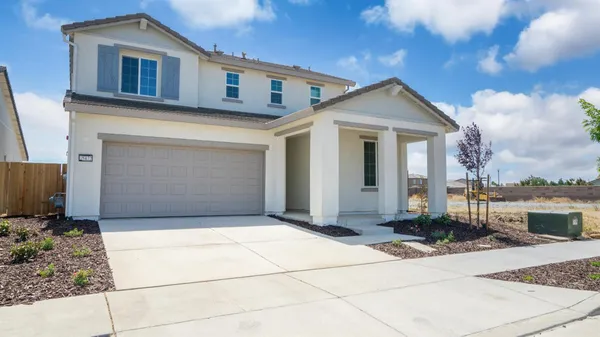 a front view of a house with a garage