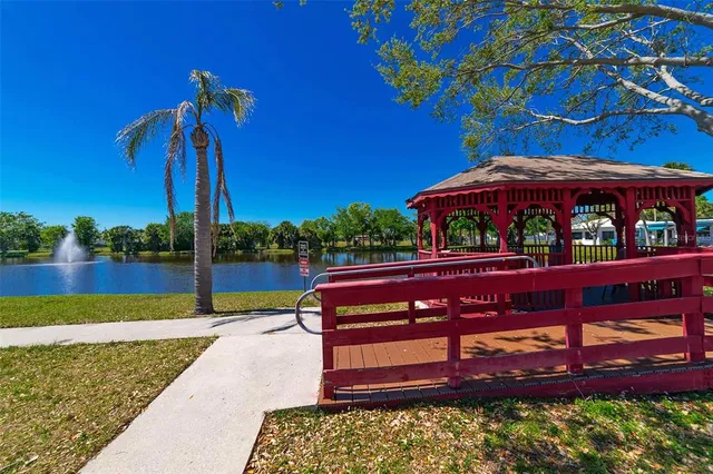 a view of a backyard with sitting area