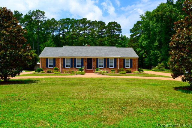 10306 Buckley Hall Road Mathews, VA 23109 - Photo 21 of 22 a front view of a house with swimming pool having outdoor seating
