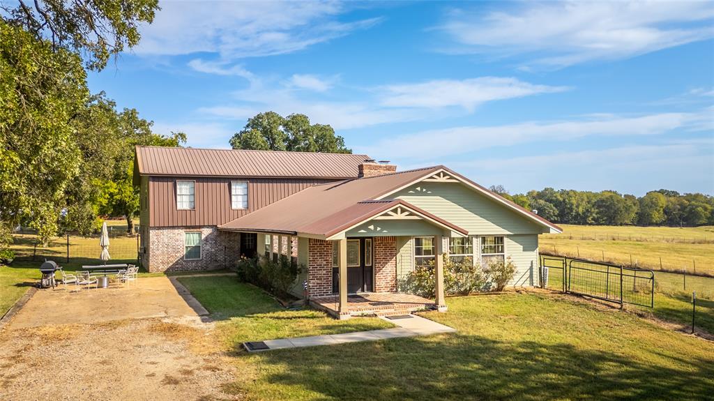 5147 Texas Highway Cooper, TX 75432 - Photo 2 of 31 a front view of a house with a yard