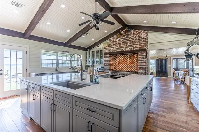 a kitchen with sink and refrigerator