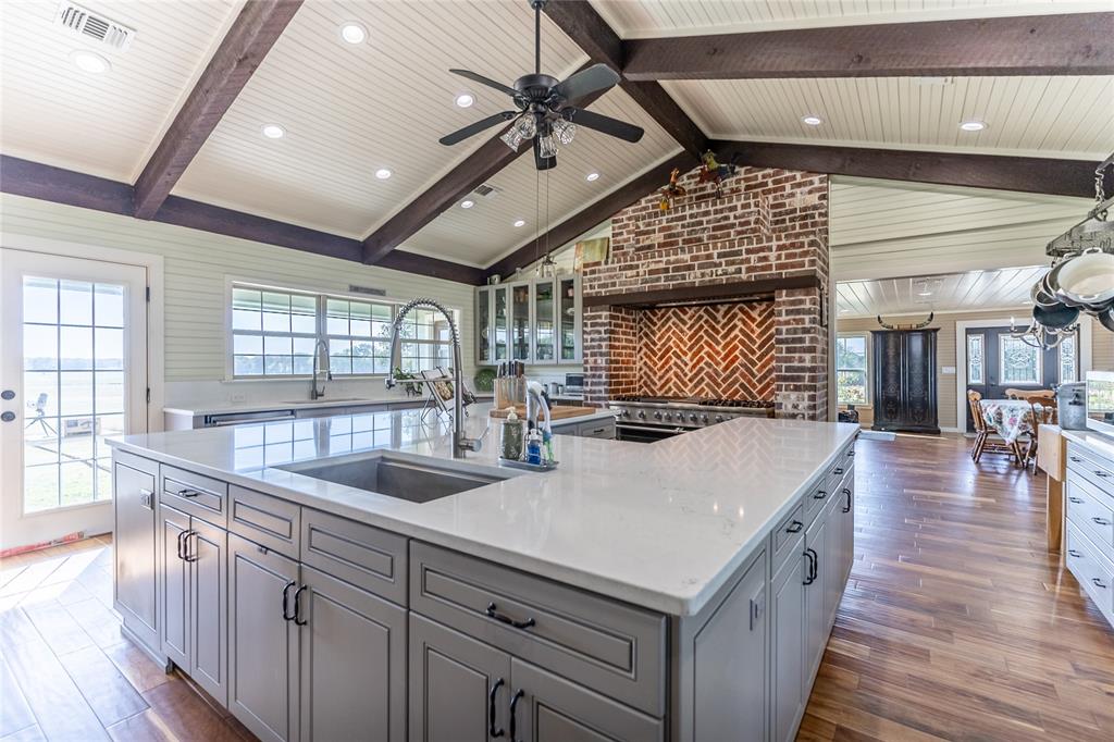 5147 Texas Highway Cooper, TX 75432 - Photo 4 of 31 a kitchen with sink and refrigerator
