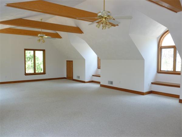 32 Townsend Farm Road Boxford, MA 01921 - Photo 19 of 25 an empty room with windows and fan