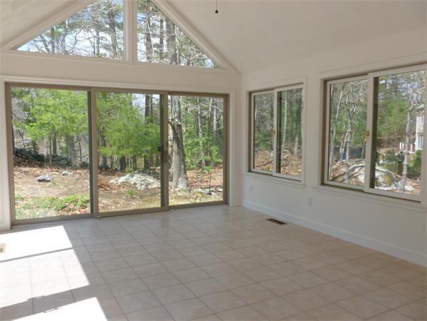 32 Townsend Farm Road Boxford, MA 01921 - Photo 21 of 25 a view of an empty room with wooden floor and a window
