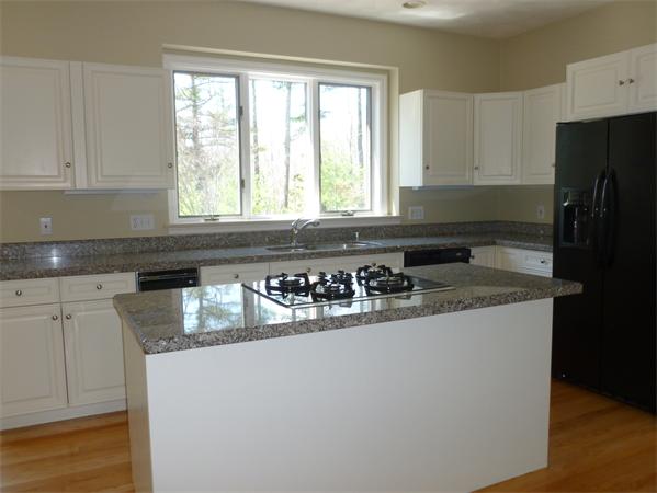 32 Townsend Farm Road Boxford, MA 01921 - Photo 4 of 25 a kitchen with a sink a window and cabinets