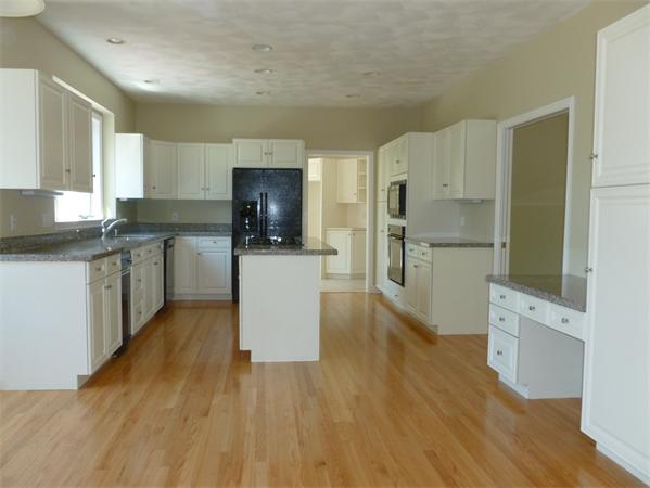 32 Townsend Farm Road Boxford, MA 01921 - Photo 7 of 25 a kitchen with a refrigerator a stove top oven a sink dishwasher and wooden floor