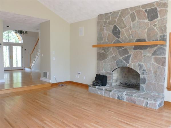 32 Townsend Farm Road Boxford, MA 01921 - Photo 9 of 25 a room with wooden floor and a fireplace