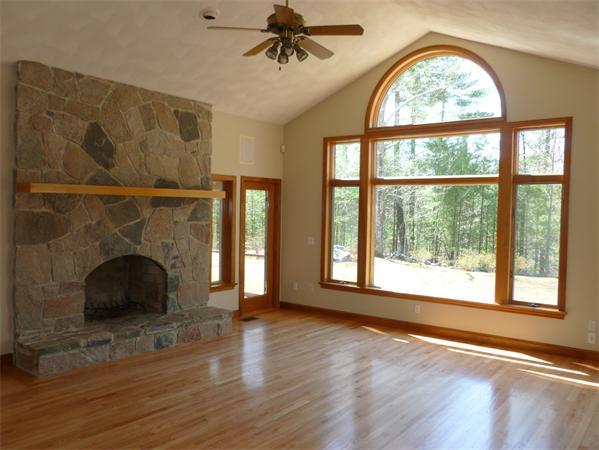 32 Townsend Farm Road Boxford, MA 01921 - Photo 10 of 25 a view of an empty room with a window and wooden floor