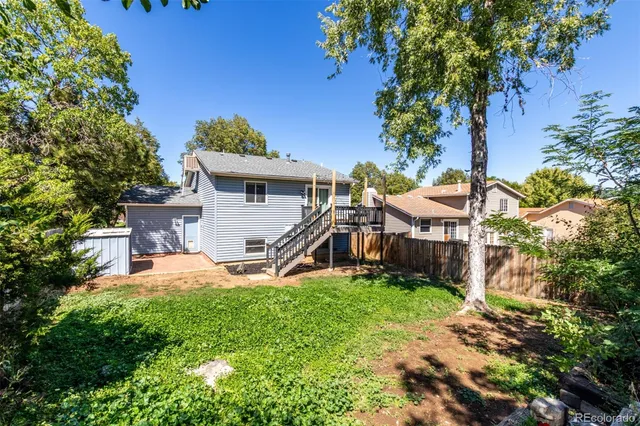a backyard of a house with lots of green space