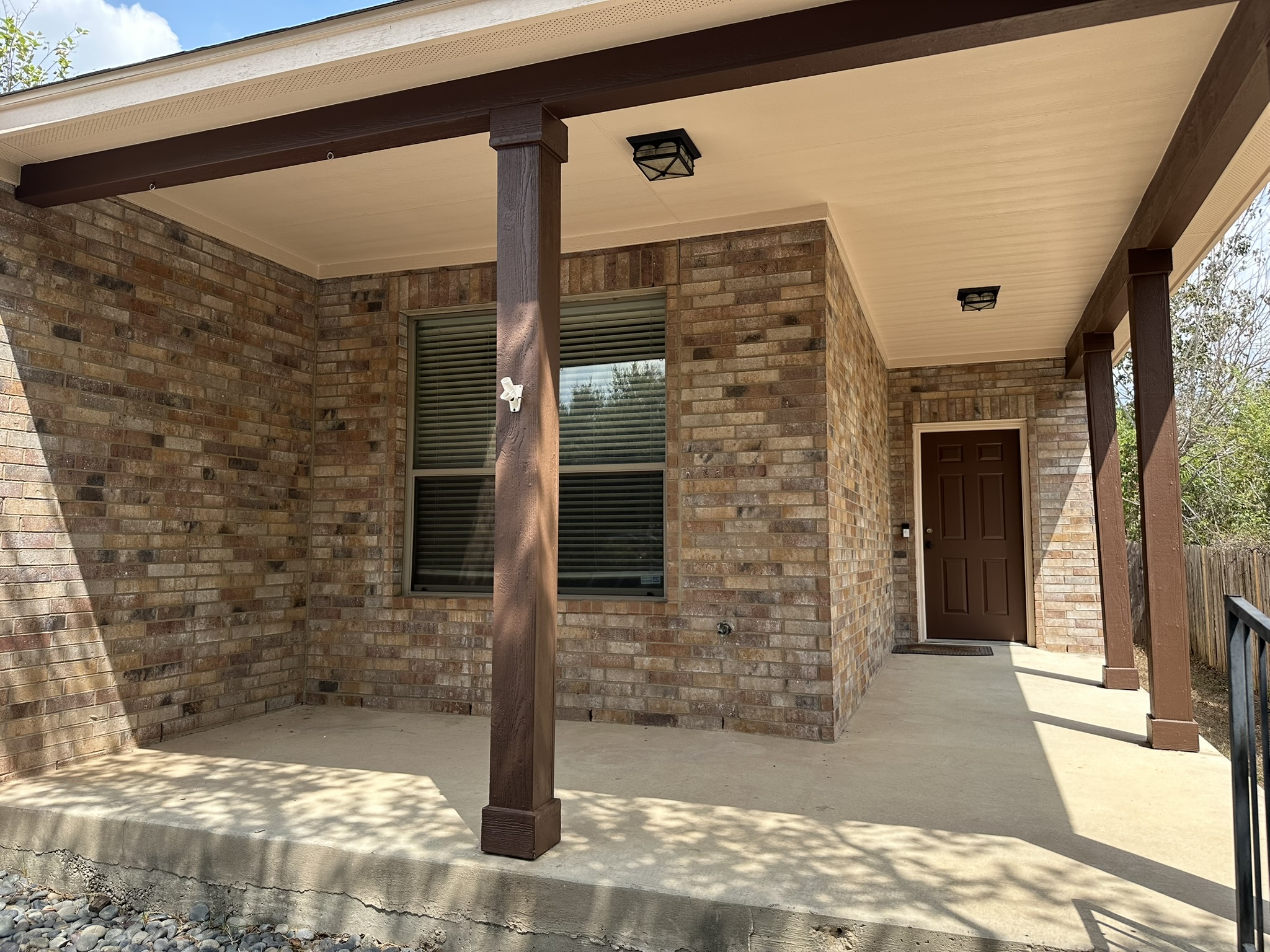 4507 Peach Grove Road Austin, TX 78744 - Photo 1 of 35 Classic brick accents and a deep covered porch offer a welcoming entry to this home.