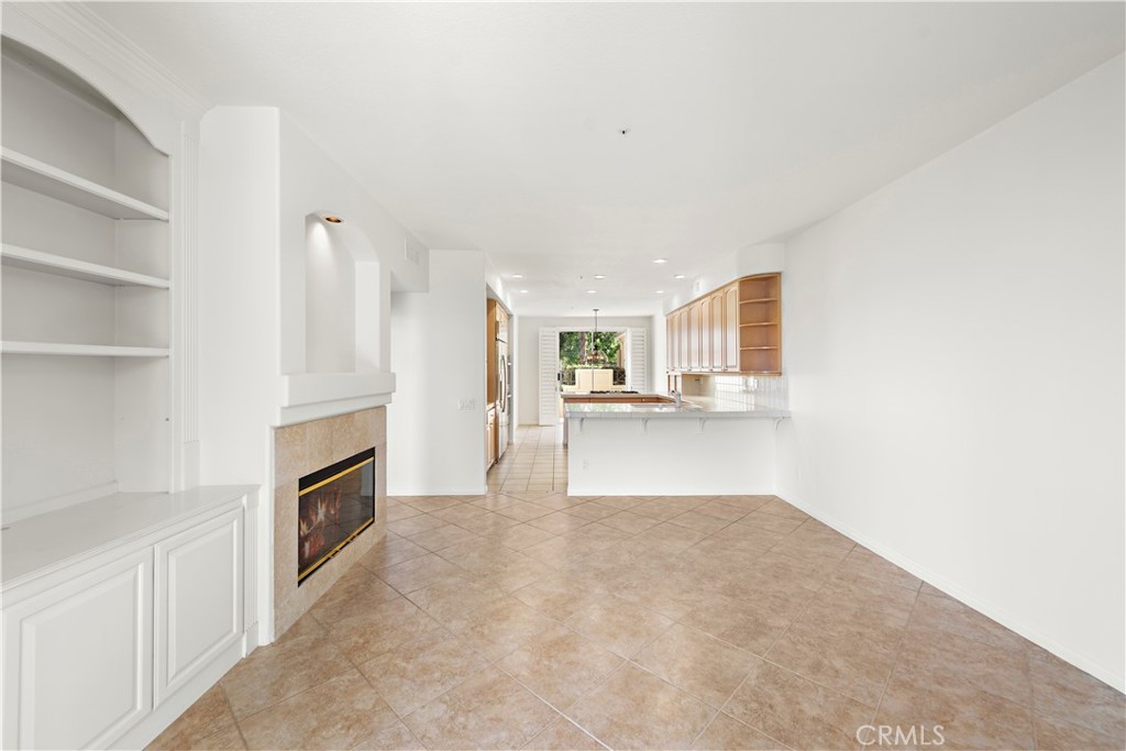 5 Siena Laguna Niguel, CA 92677 - Photo 28 of 61 family room with built-in cabinetry and a fireplace