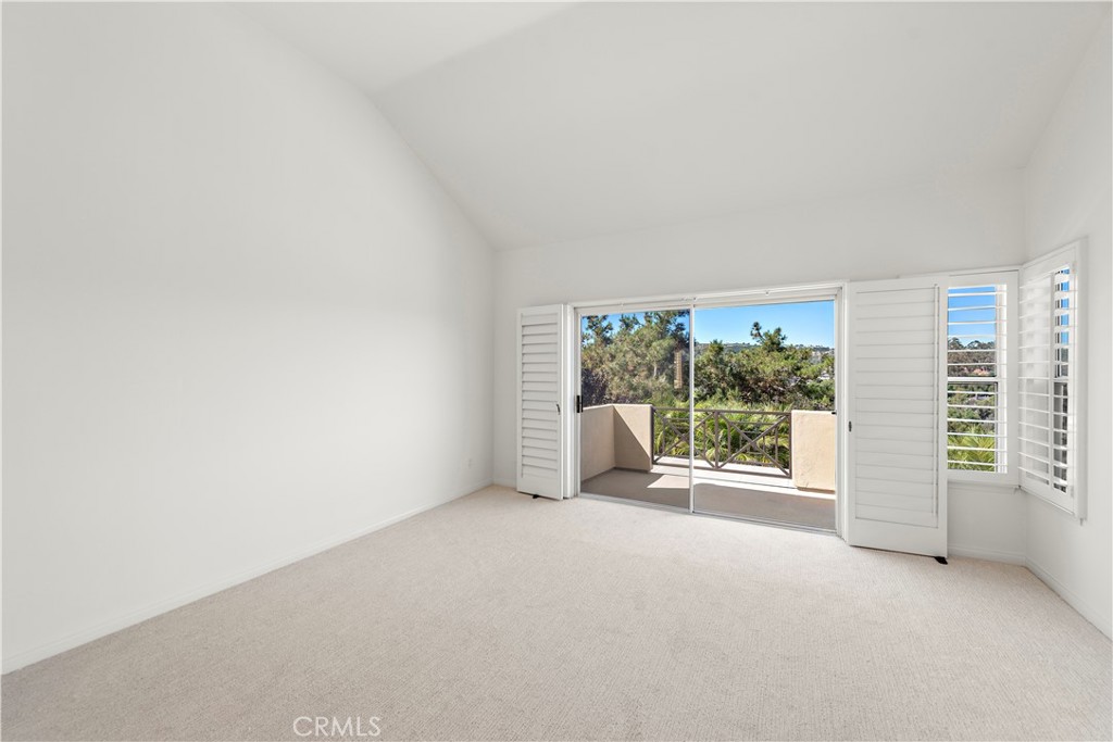5 Siena Laguna Niguel, CA 92677 - Photo 33 of 61 Primary suite with a balcony and fireplace
