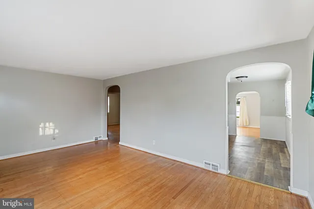 a bedroom with a bed and cabinets