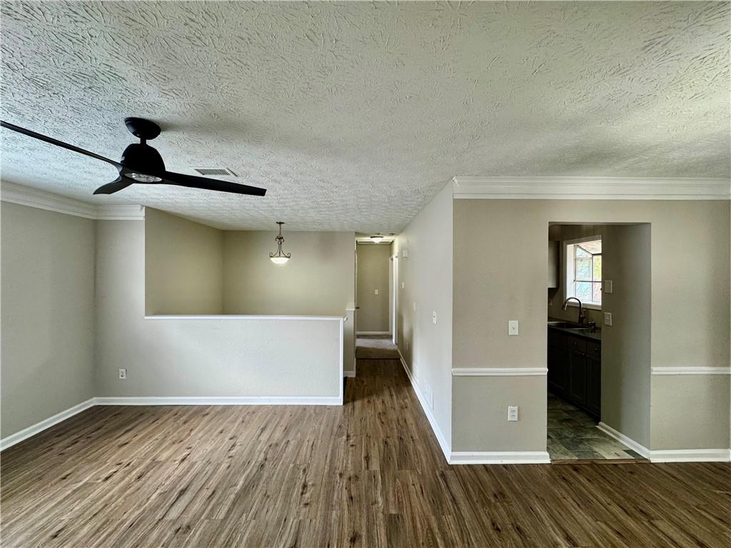4922 Windsor Downs Lane Decatur, GA 30035 - Photo 13 of 23 a view of empty room with wooden floor