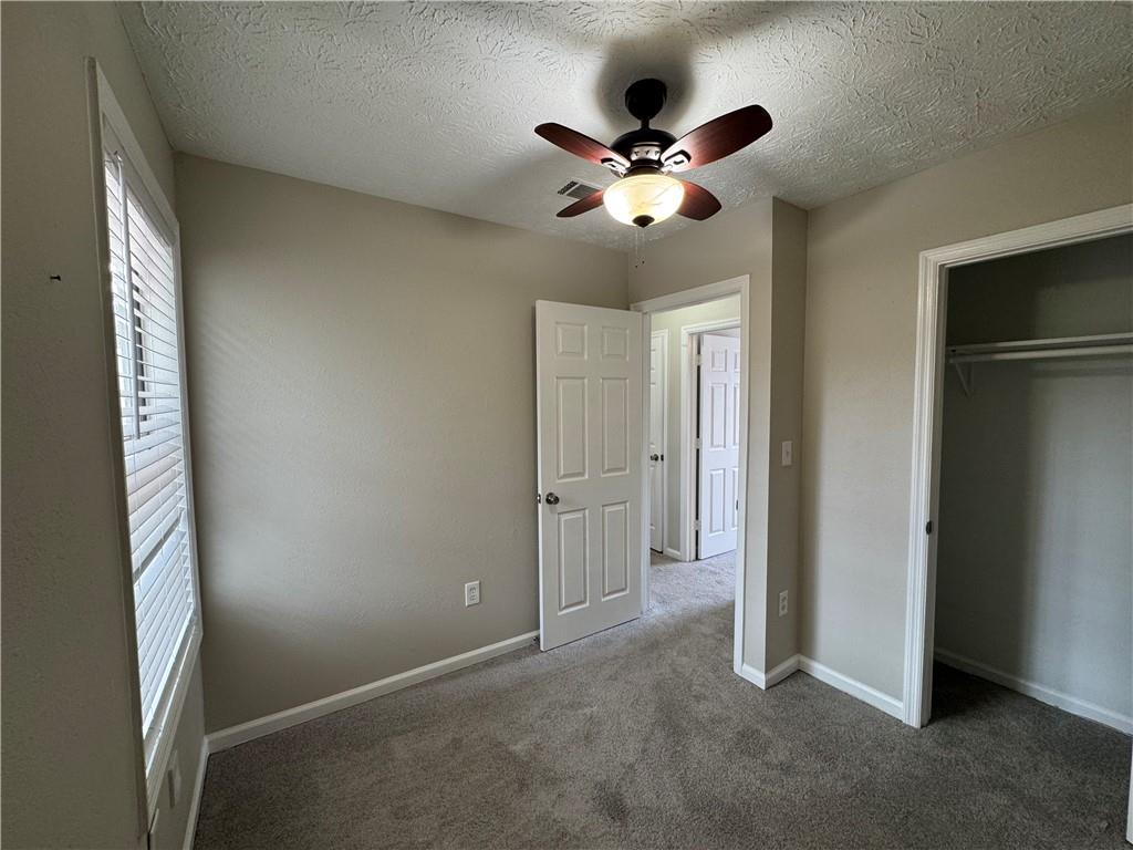 4922 Windsor Downs Lane Decatur, GA 30035 - Photo 17 of 23 a view of an empty room with a window