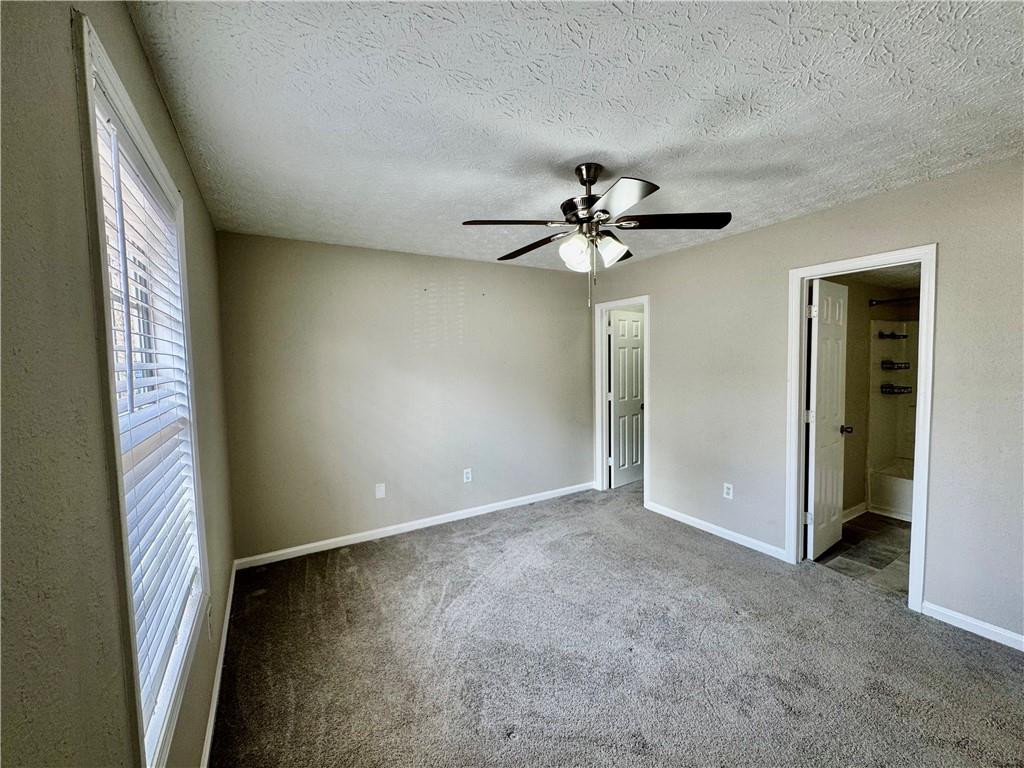 4922 Windsor Downs Lane Decatur, GA 30035 - Photo 18 of 23 a view of an empty room with a window