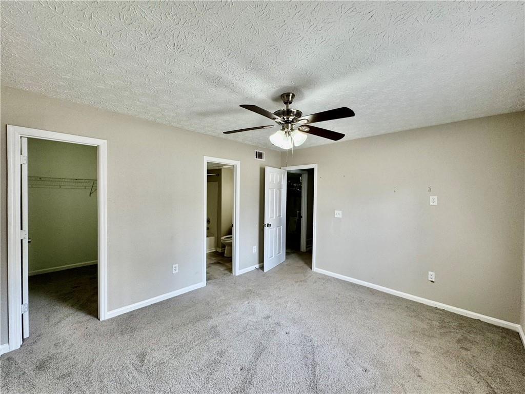4922 Windsor Downs Lane Decatur, GA 30035 - Photo 19 of 23 a view of a livingroom with a chandelier fan and entryway