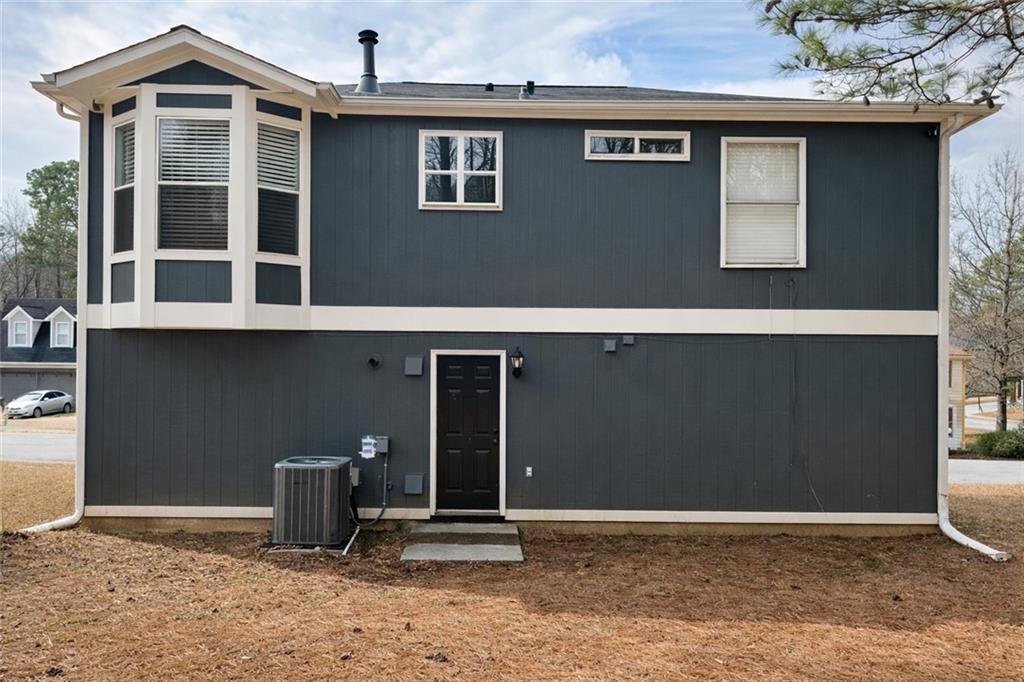 4922 Windsor Downs Lane Decatur, GA 30035 - Photo 5 of 23 a front view of a house with parking space