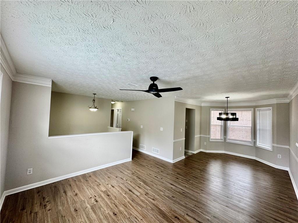 4922 Windsor Downs Lane Decatur, GA 30035 - Photo 7 of 23 wooden floor in an empty room with a window