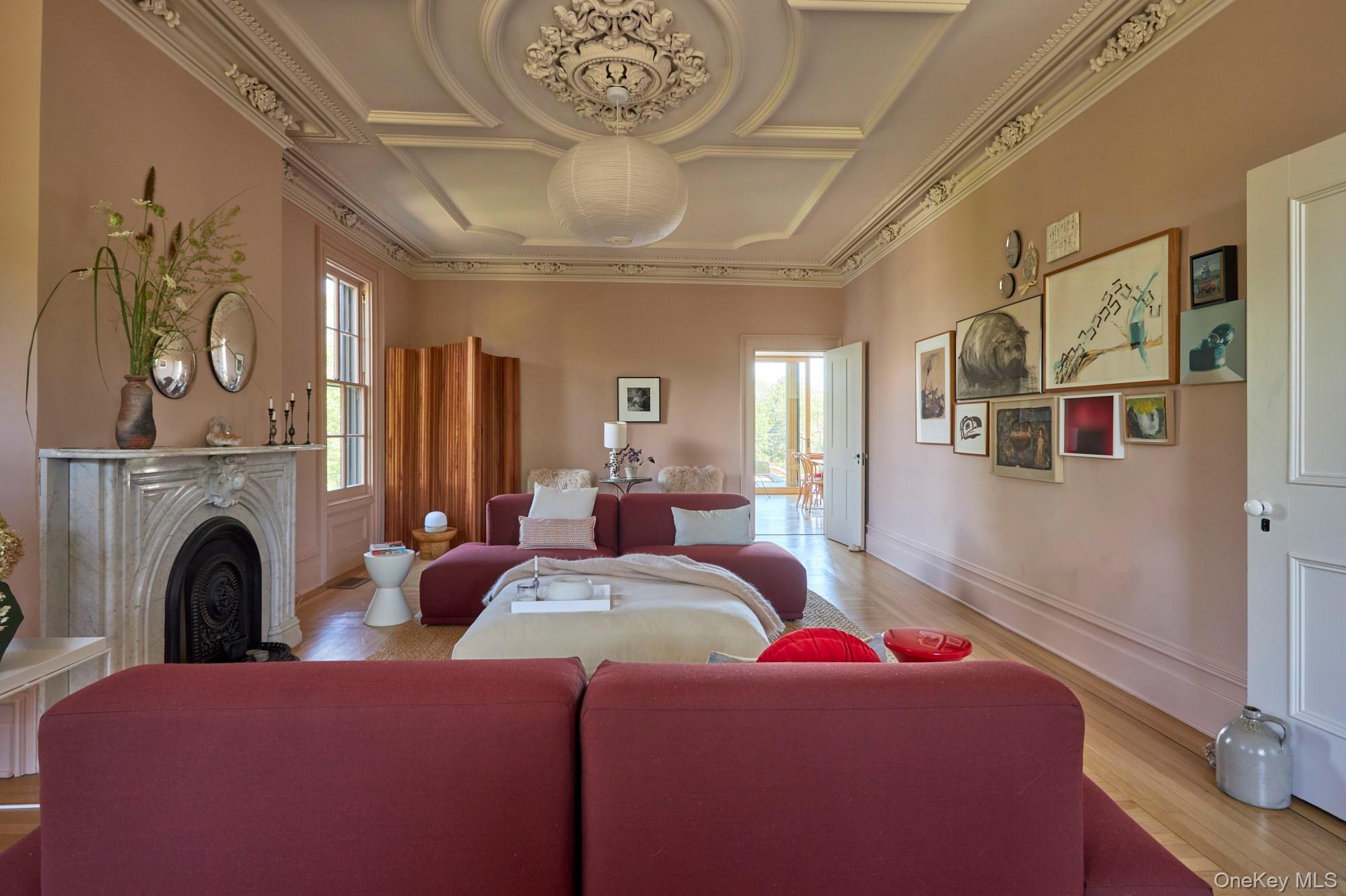44 Main Street Germantown, NY 12526 - Photo 13 of 34 Living room featuring wood finished floors, coffered ceiling, a fireplace, and ornamental molding