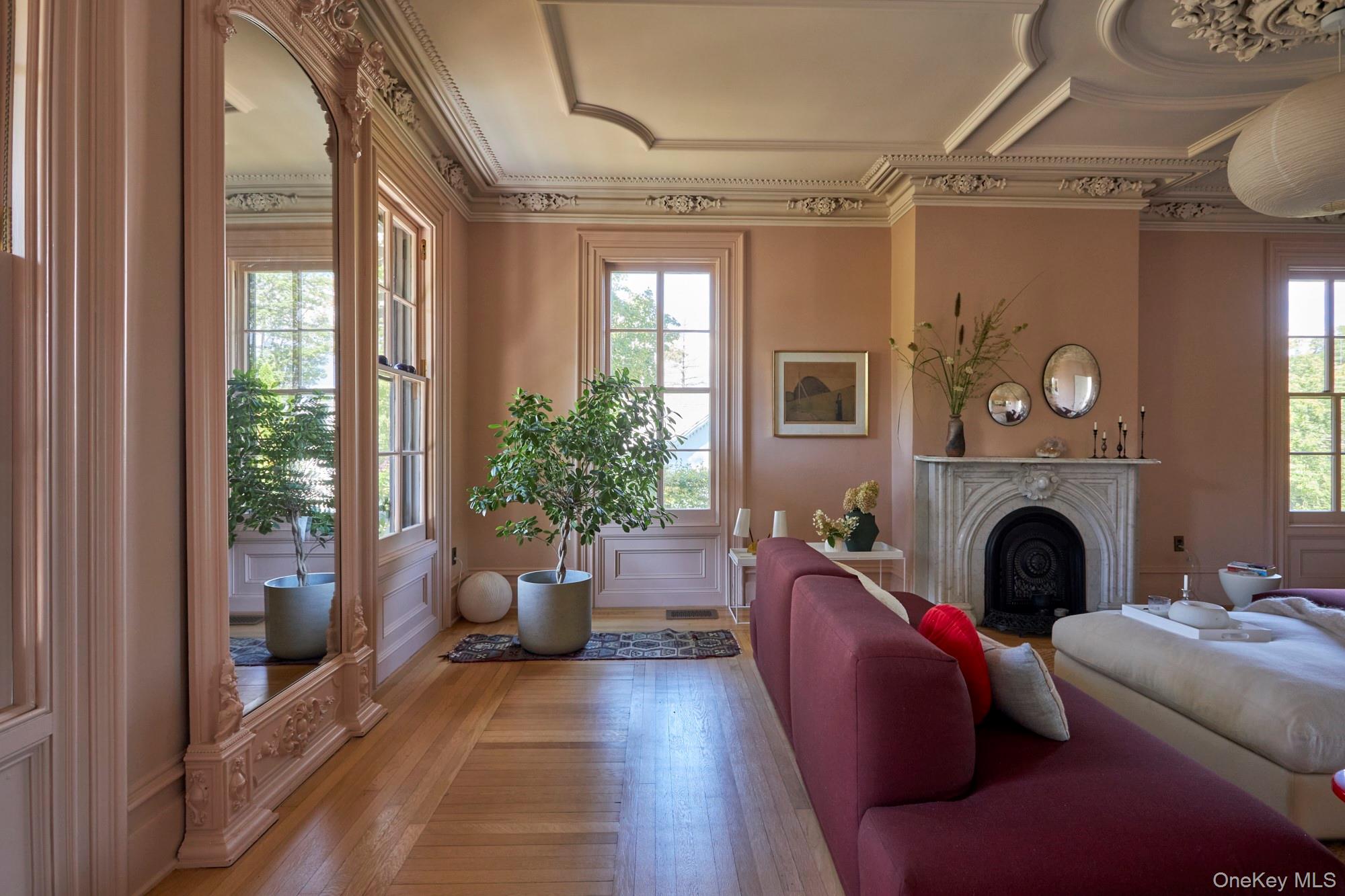 44 Main Street Germantown, NY 12526 - Photo 15 of 34 Living area featuring a fireplace, crown molding, wood-type flooring, and plenty of natural light