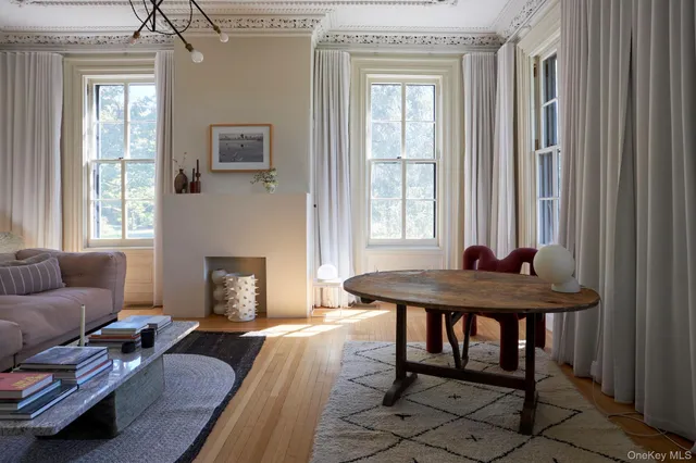 a bedroom with a bed and a table chair