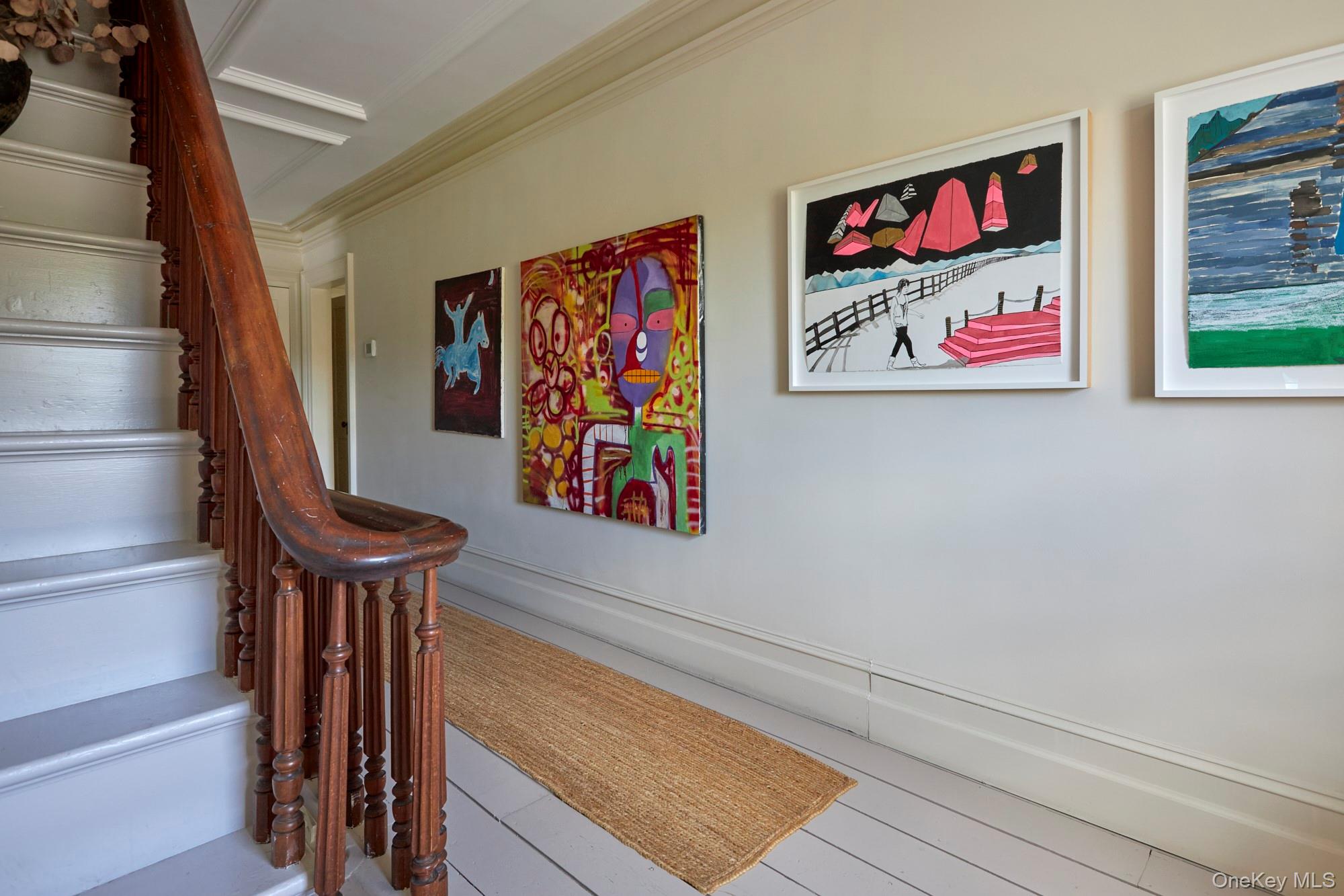 44 Main Street Germantown, NY 12526 - Photo 23 of 34 Staircase featuring crown molding and baseboards