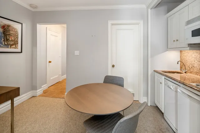 a picture of a rug with a white wall and a picture of the side