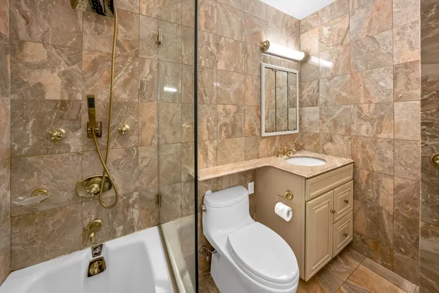 a living room with furniture and a dining table with kitchen island