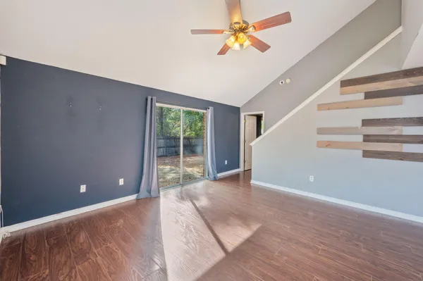 a view of an empty room with a window