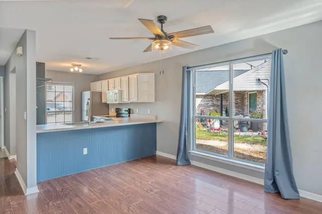 a workspace with a window and a kitchen