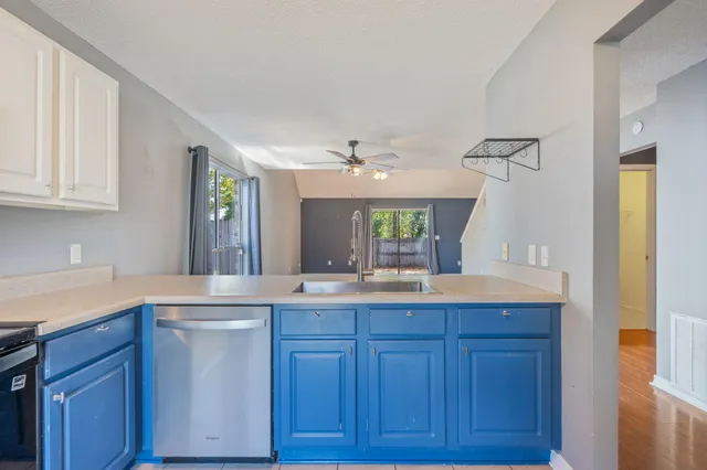 a kitchen with a sink and cabinets