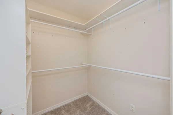 a view of an empty walk in closet