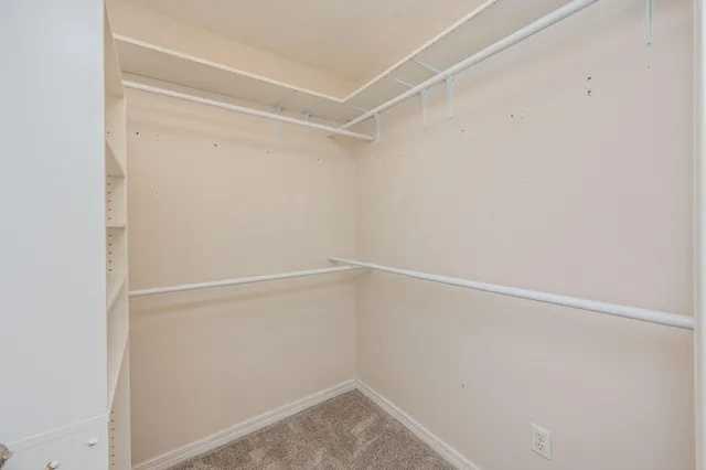 a view of an empty walk in closet