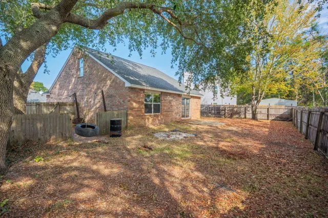 a view of a backyard with a small cabin