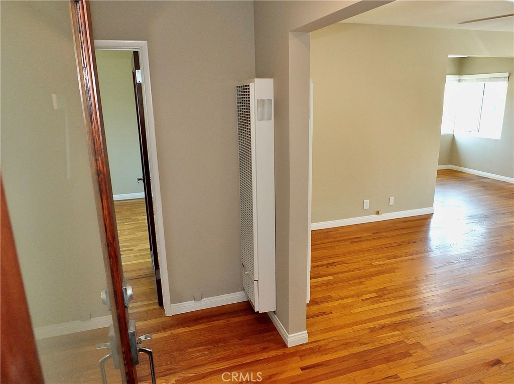 1808 East Appleton Street, Unit 7 Long Beach, CA 90802 - Photo 10 of 44 an empty room with wooden floor and entrance