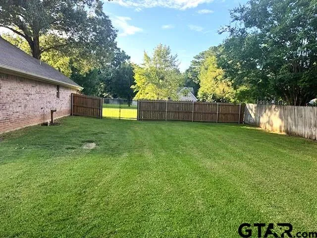 a view of a backyard with a small cabin