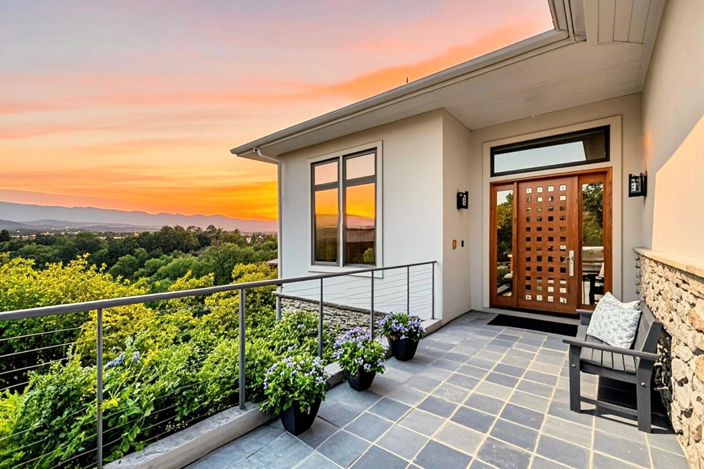 a view of a porch with furniture and a gate