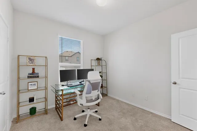 a view of a workspace with furniture